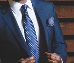 man-in-blue-suit-and-tie