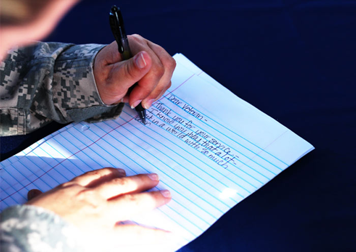 Soldier writing to a veteran